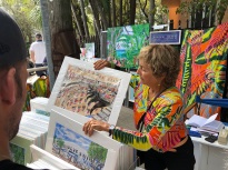 My friend Eileen Seitz shows off her tropical paintings.